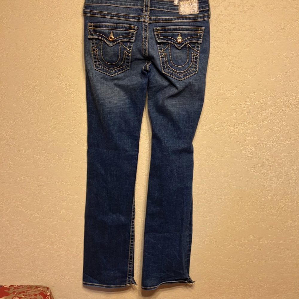30W x 34 L TRUE RELIGION BLUE JEANS WITH SPLIT HEM